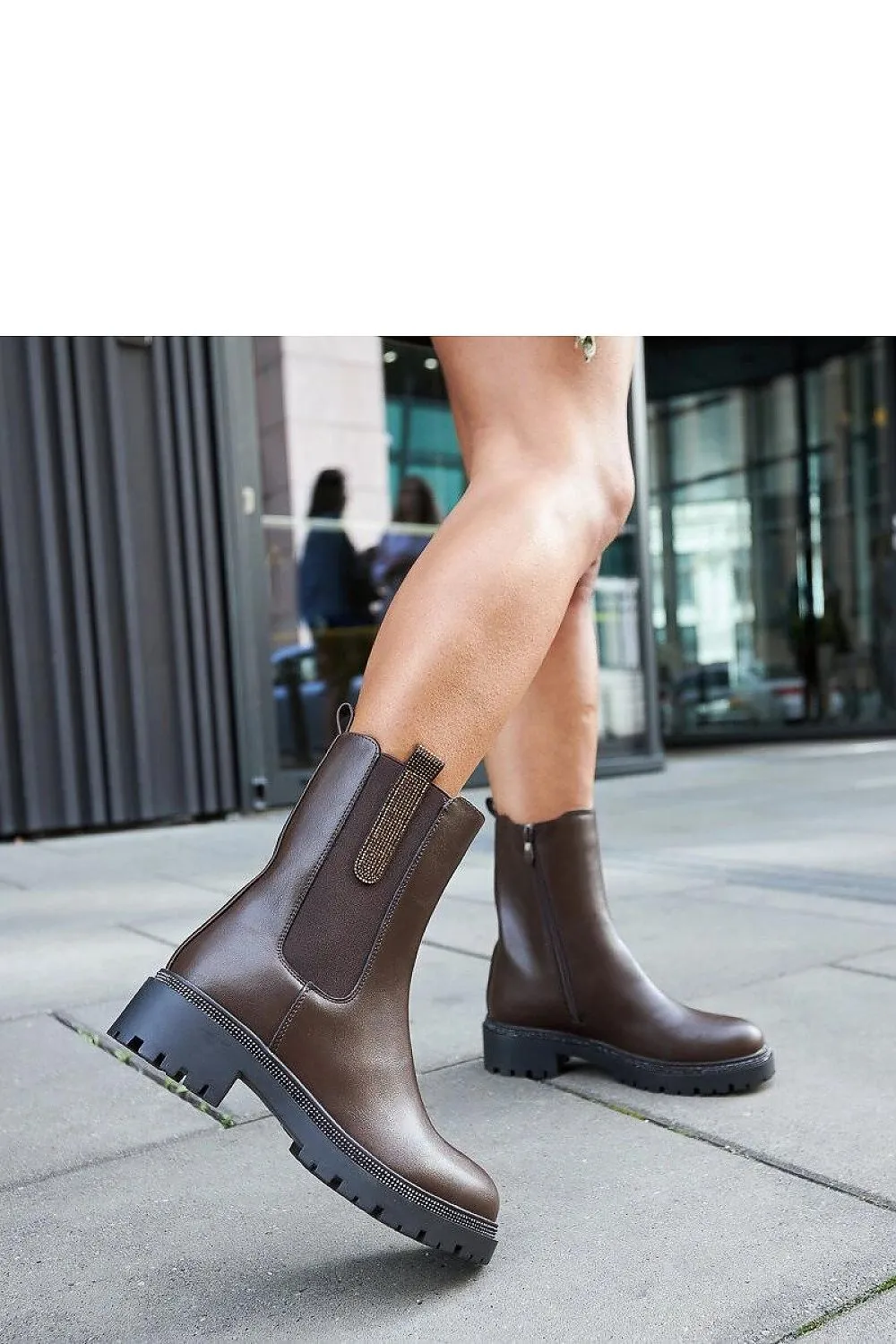Brown high boots embellished with zircons