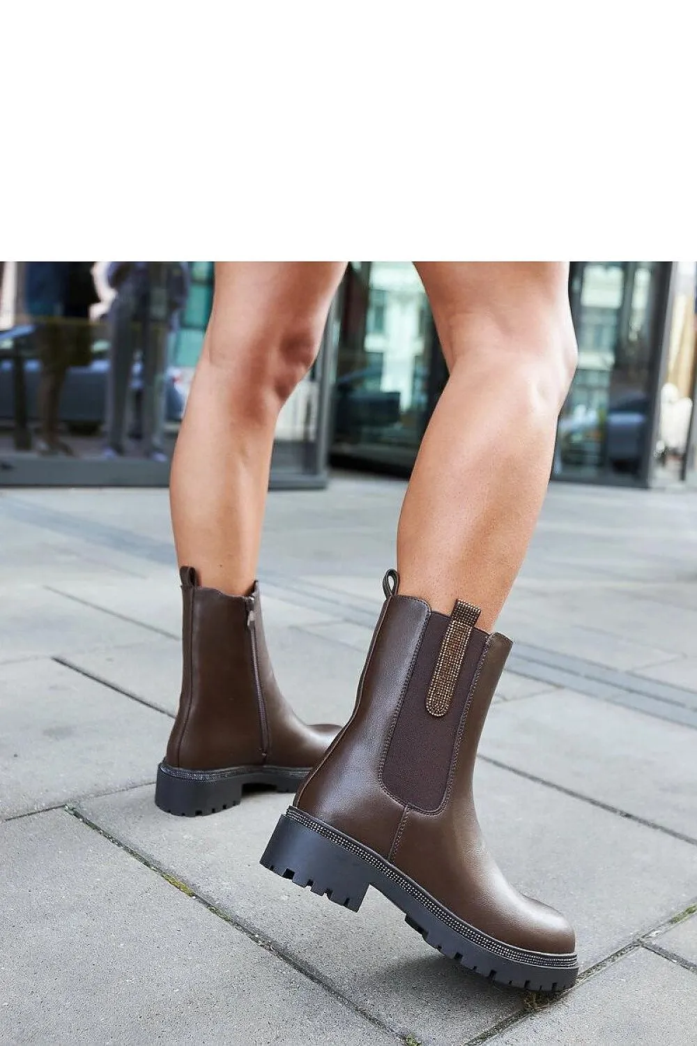 Brown high boots embellished with zircons